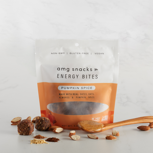 Pumpkin Spice Energy Bites with almond pieces on marble.